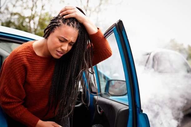 black woman auto accident hurt head